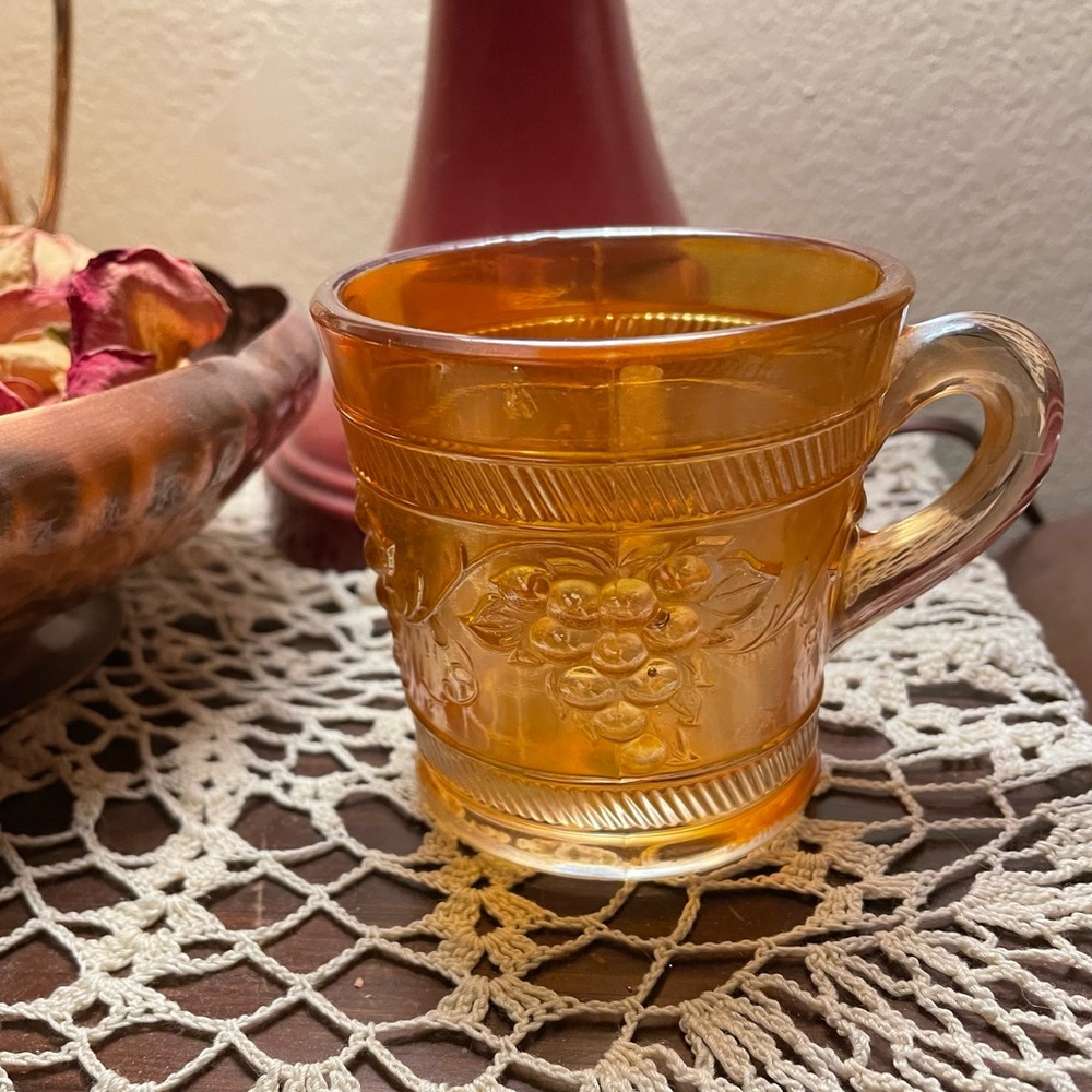 Lustrous Peach Glass Cup with a Grape Design